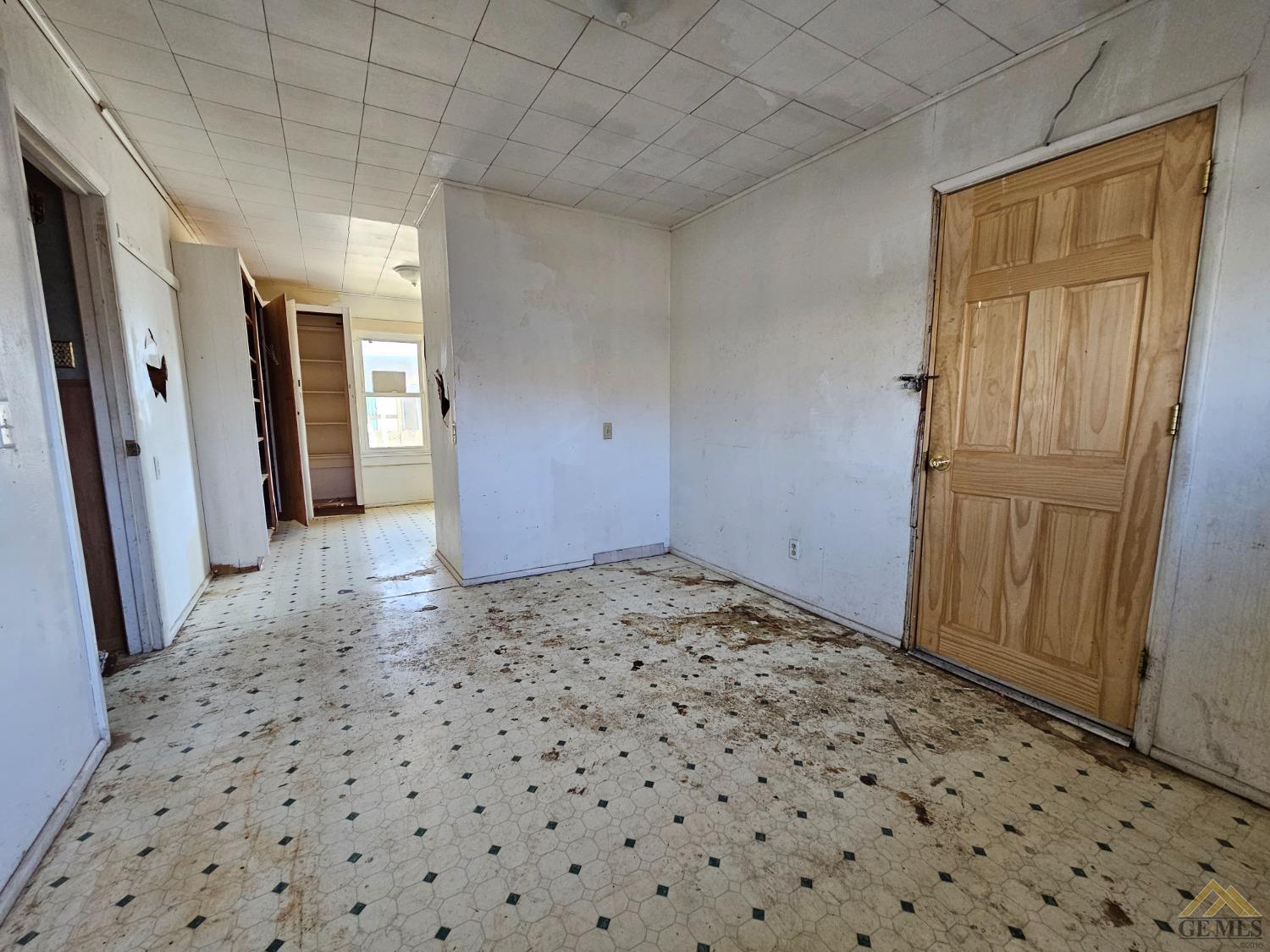Undisclosed Address Taft, CA 93268 - Photo 17 of 20 a view of a big room with closet and wooden door