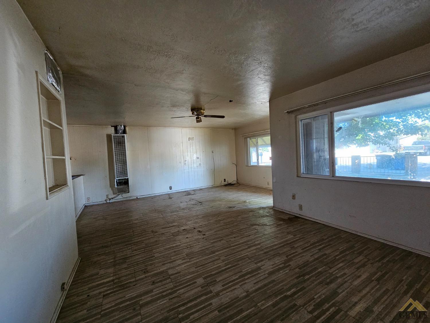 Undisclosed Address Taft, CA 93268 - Photo 8 of 20 a view of empty room with wooden floor and fan