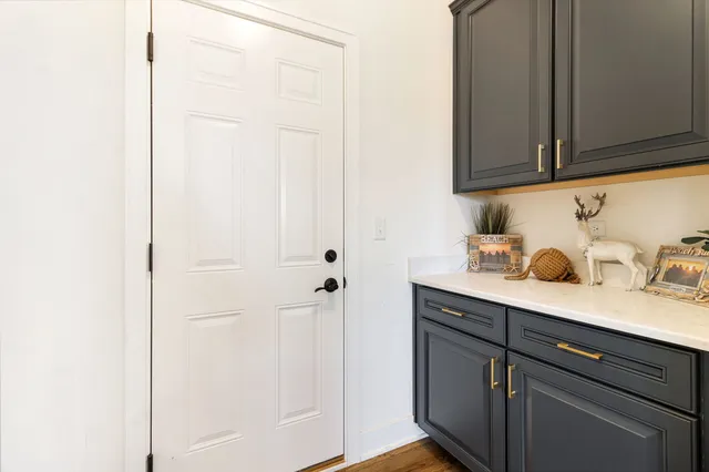 a view of cabinets and wooden floor