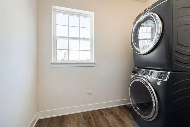 a view of a storage and utility room with a washer dryer