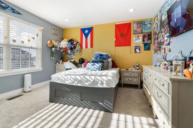 a bed room with a bed and a furniture