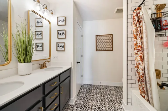 a bathroom with a sink and a mirror