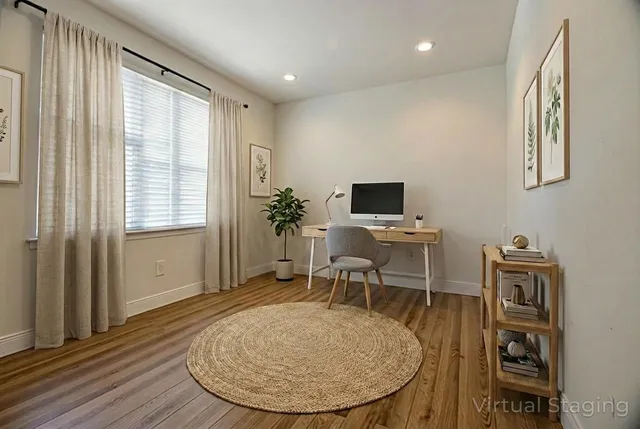 wooden floor and dining room with furniture window and wooden floor