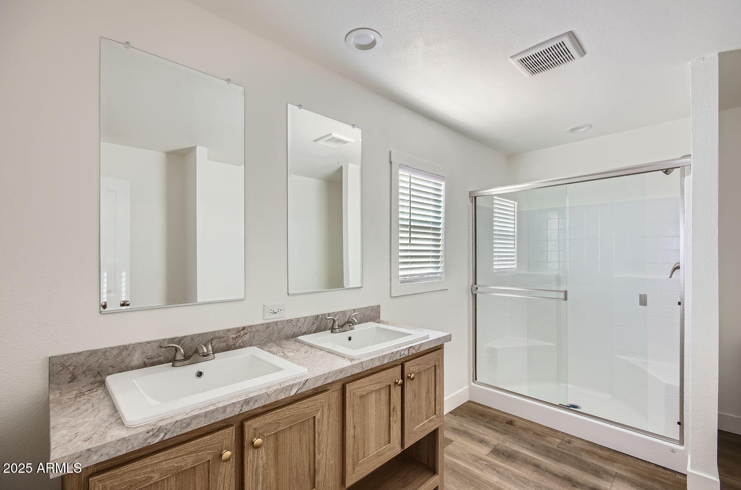 54362 West Thola Road Maricopa, AZ 85139 - Photo 2 of 9 a bathroom with a sink and a mirror