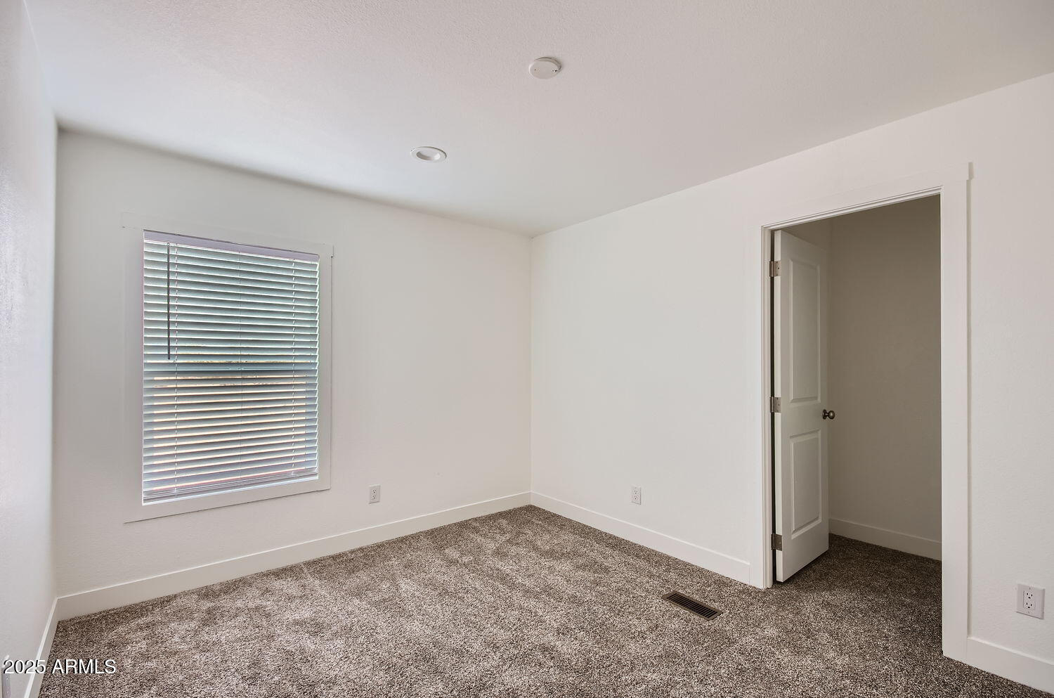 54362 West Thola Road Maricopa, AZ 85139 - Photo 4 of 9 a view of an empty room with a window