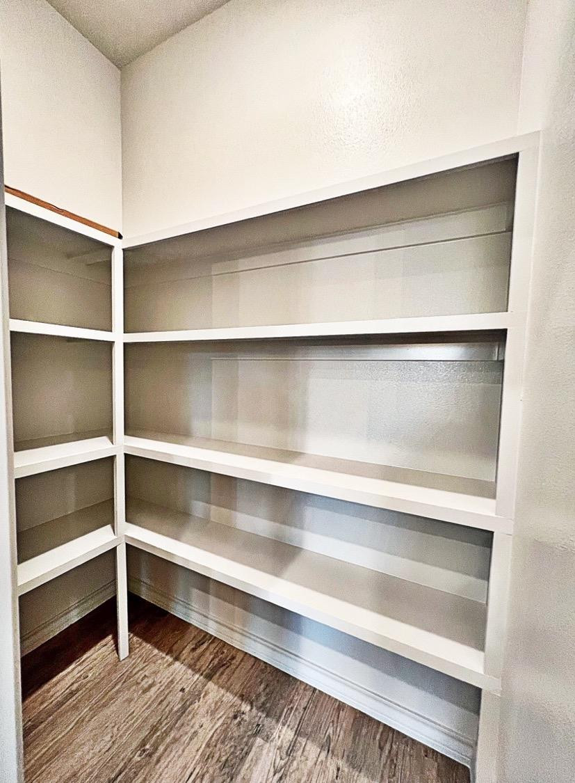 6920 17th Street Lubbock, TX 79416 - Photo 12 of 34 a view of walk in closet with empty racks