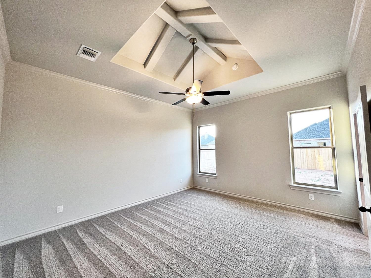 6920 17th Street Lubbock, TX 79416 - Photo 17 of 34 a view of empty room with wooden floor and fan
