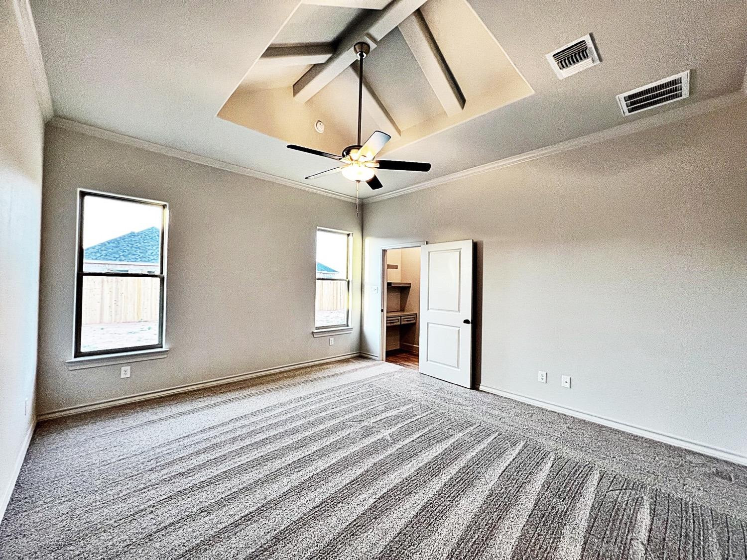 6920 17th Street Lubbock, TX 79416 - Photo 18 of 34 a view of a livingroom with a ceiling fan and window