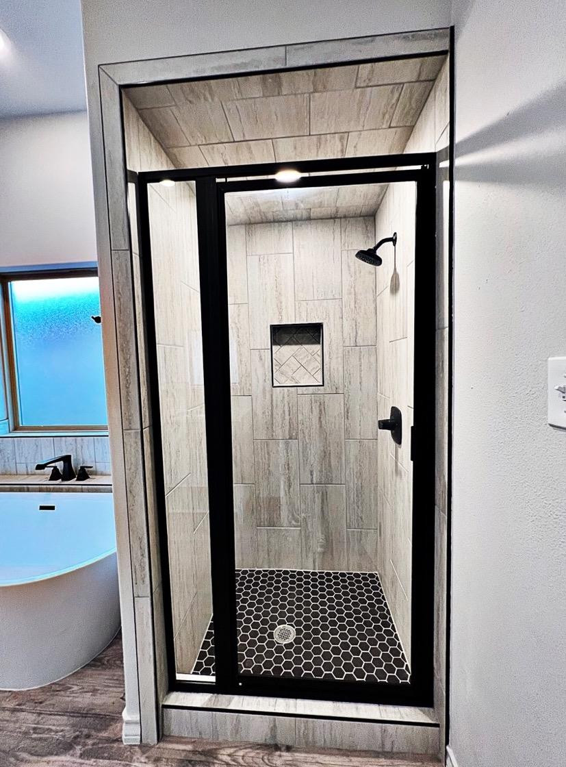 6920 17th Street Lubbock, TX 79416 - Photo 22 of 34 a bathroom with a shower