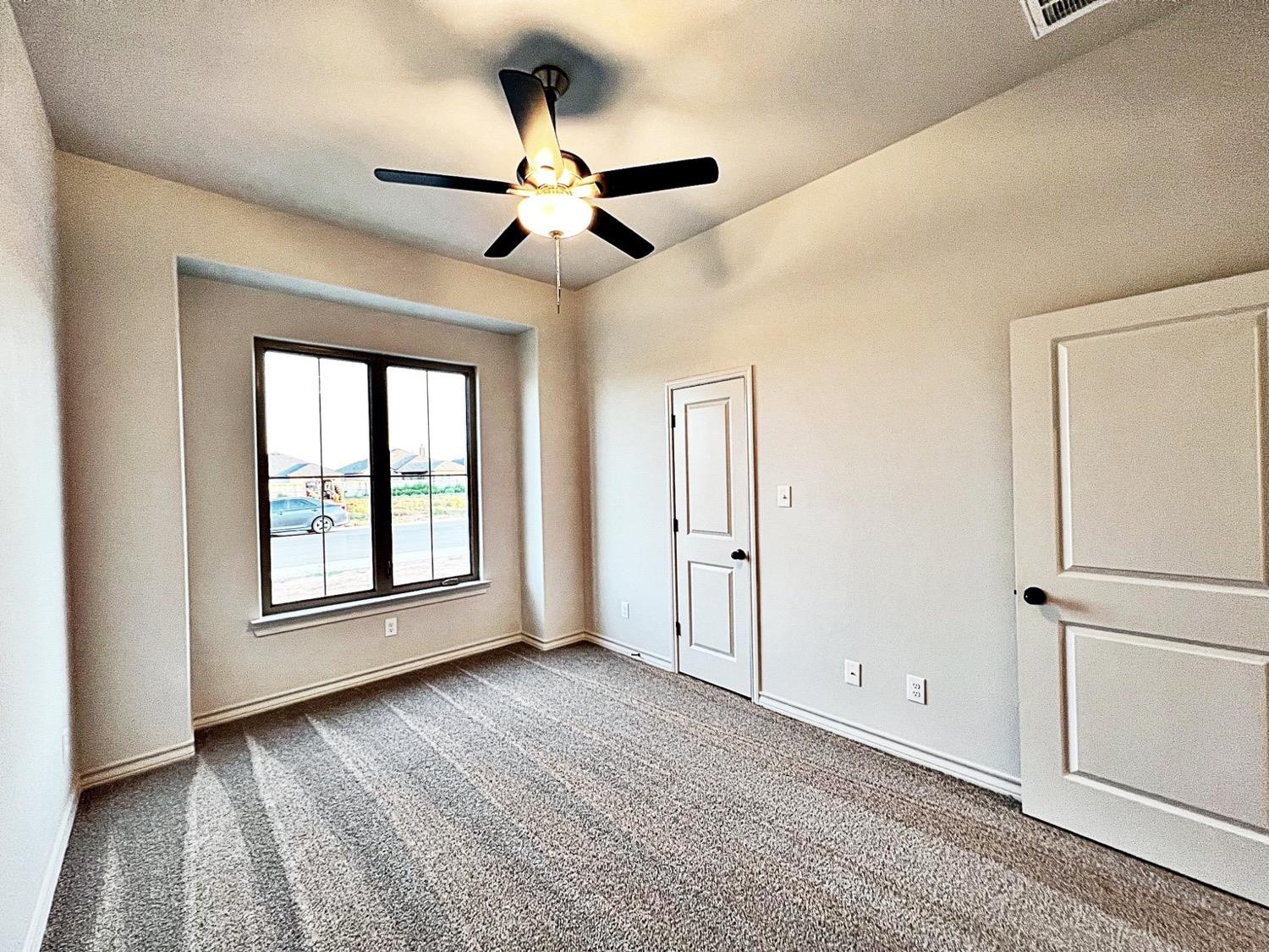 6920 17th Street Lubbock, TX 79416 - Photo 25 of 34 a view of an empty room with a window