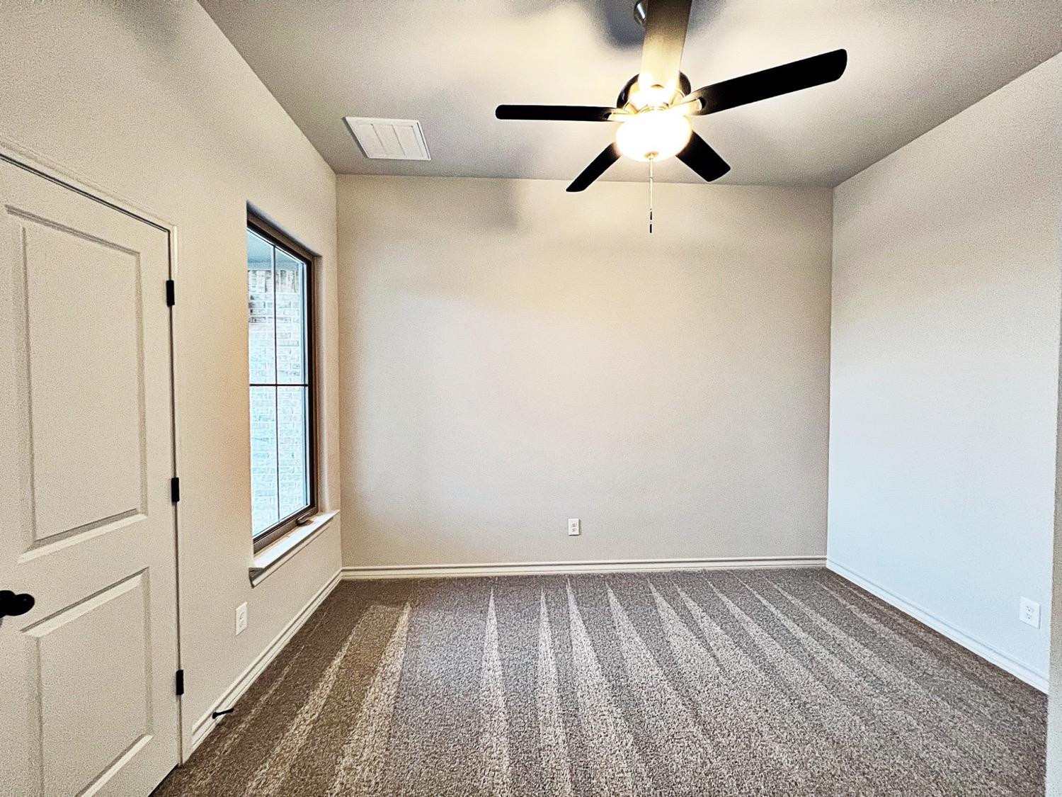6920 17th Street Lubbock, TX 79416 - Photo 28 of 34 a view of an empty room with a window