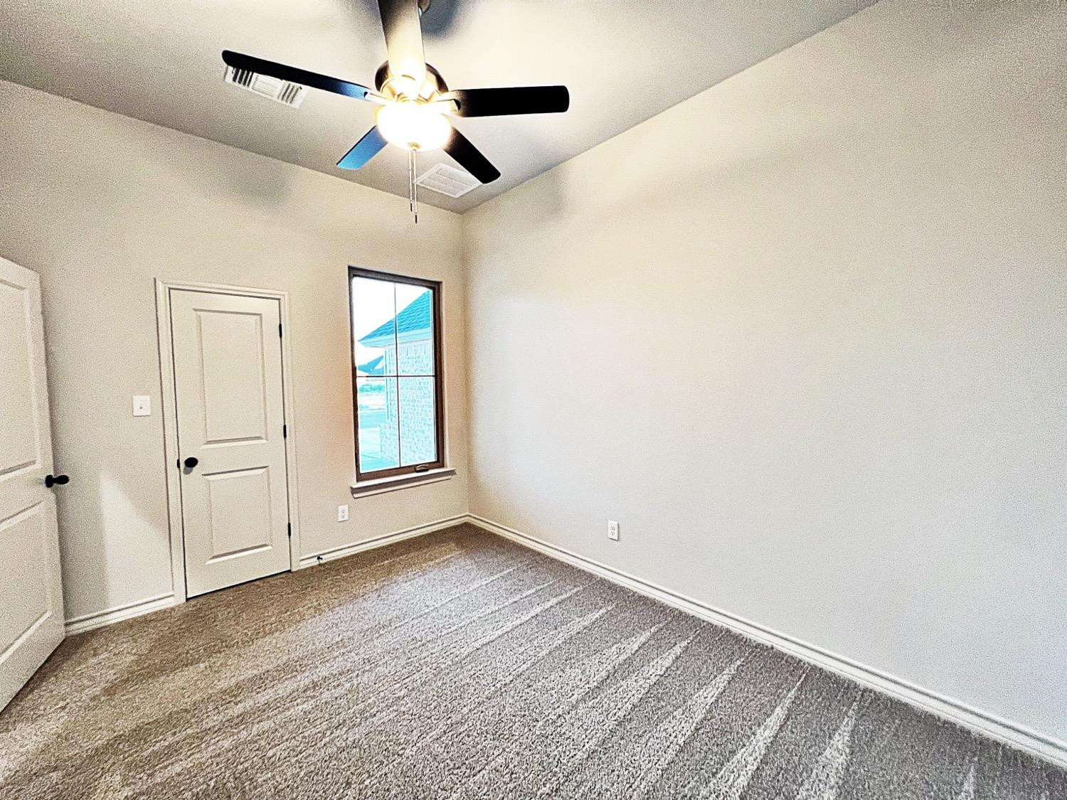 6920 17th Street Lubbock, TX 79416 - Photo 29 of 34 a view of an empty room with a window