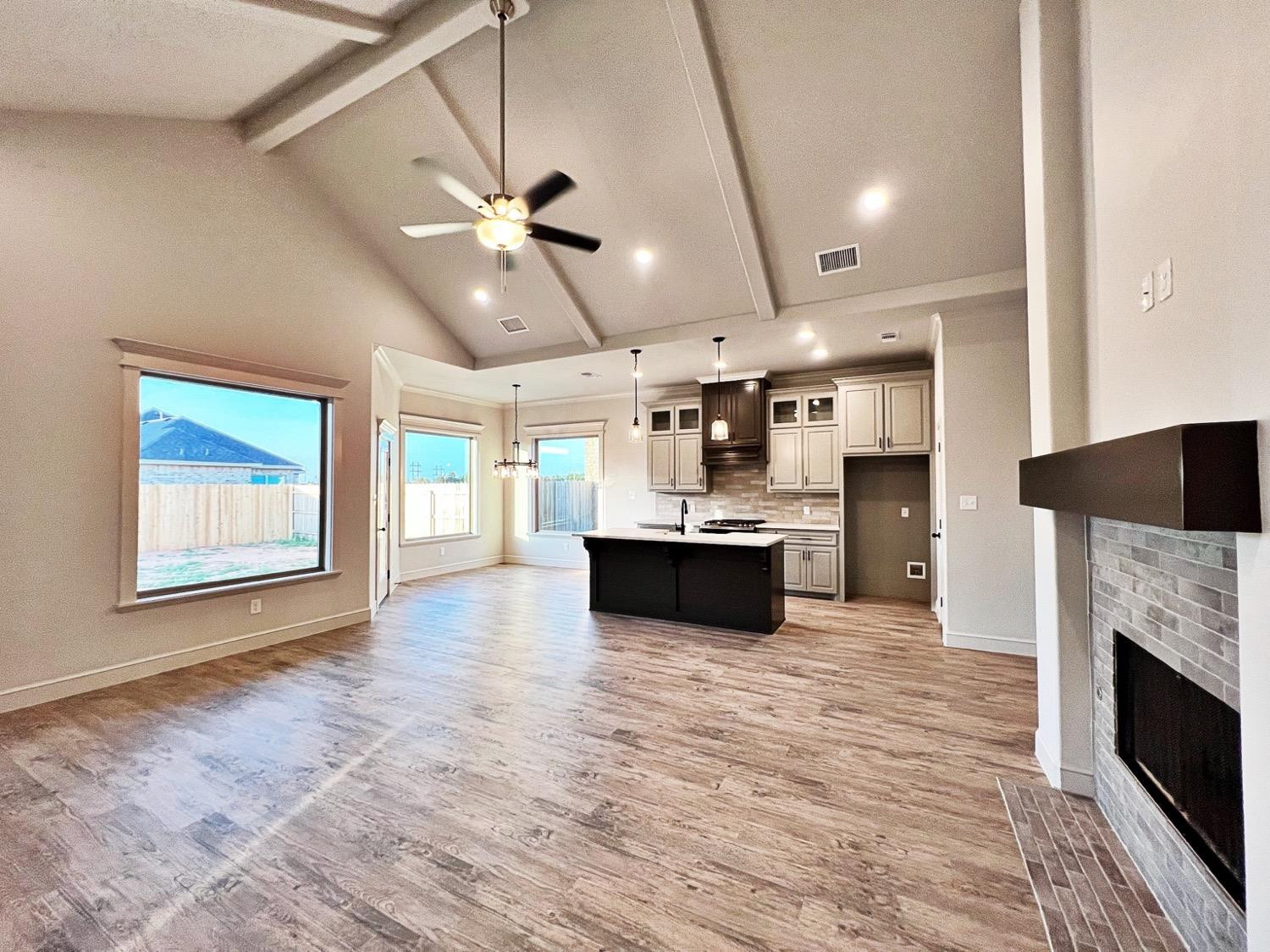 6920 17th Street Lubbock, TX 79416 - Photo 3 of 34 a large white kitchen with a large window