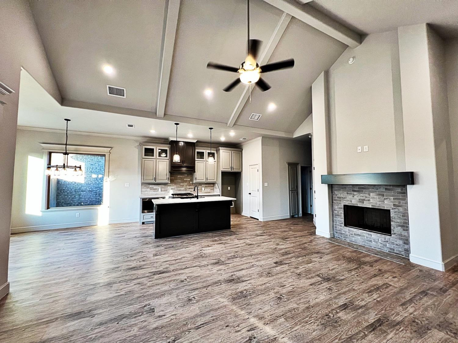 6920 17th Street Lubbock, TX 79416 - Photo 4 of 34 a large white kitchen with a stove and a refrigerator
