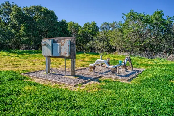 a view of a park with furniture