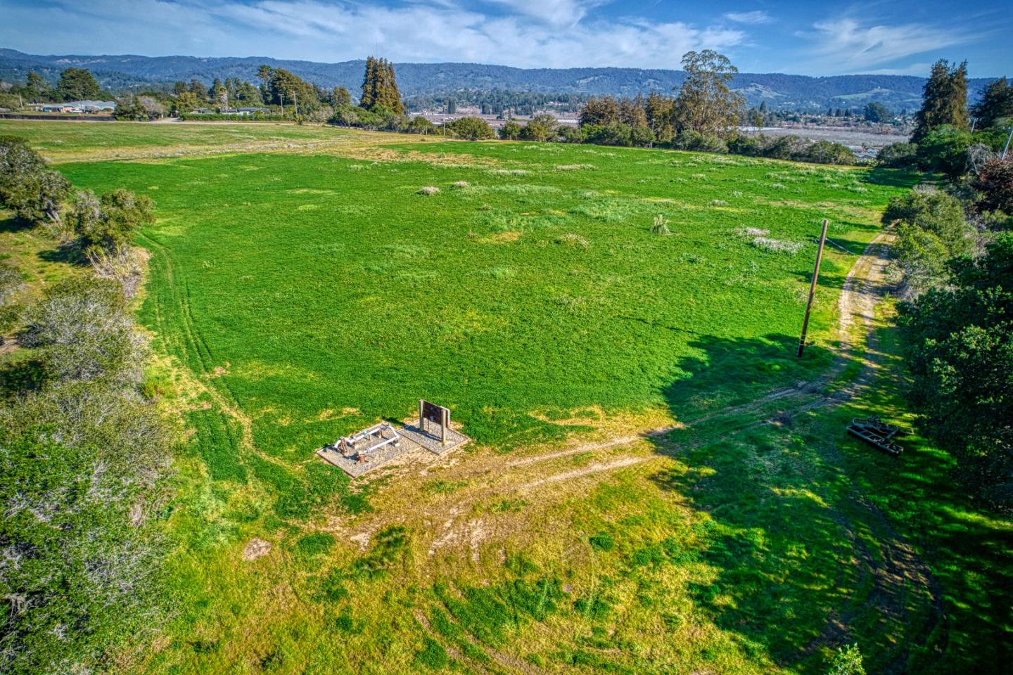 571 Calabasas Road Watsonville, CA 95076 - Photo 5 of 6 a view of a lush green outdoor space with a swimming pool and valleys