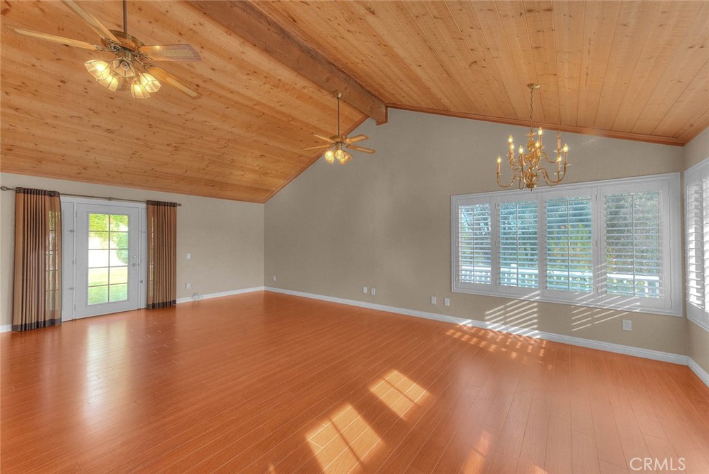 30673 Del Rey Road Temecula, CA 92591 - Photo 12 of 47 Bonus Room Entering From Living Room. Left Entry Door Leads To Rear Yard. Wood Vaulted Ceiling. Panoramic View Of Lower Rear Area From Windows.