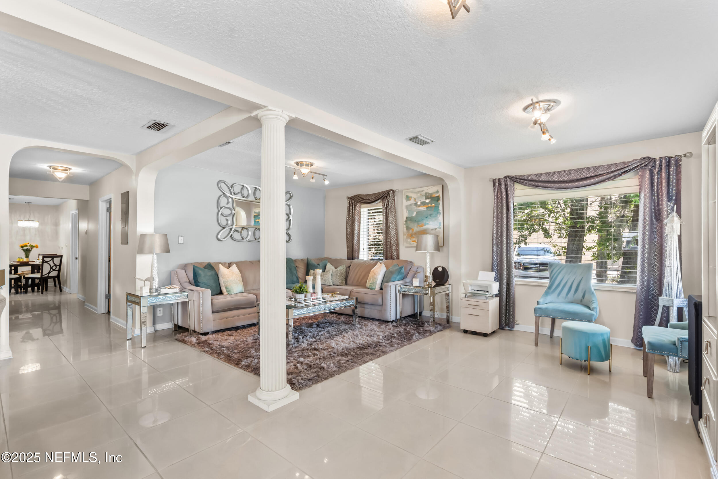 1887 Mayport Road Atlantic Beach, FL 32233 - Photo 11 of 50 a living room with furniture large window and a table