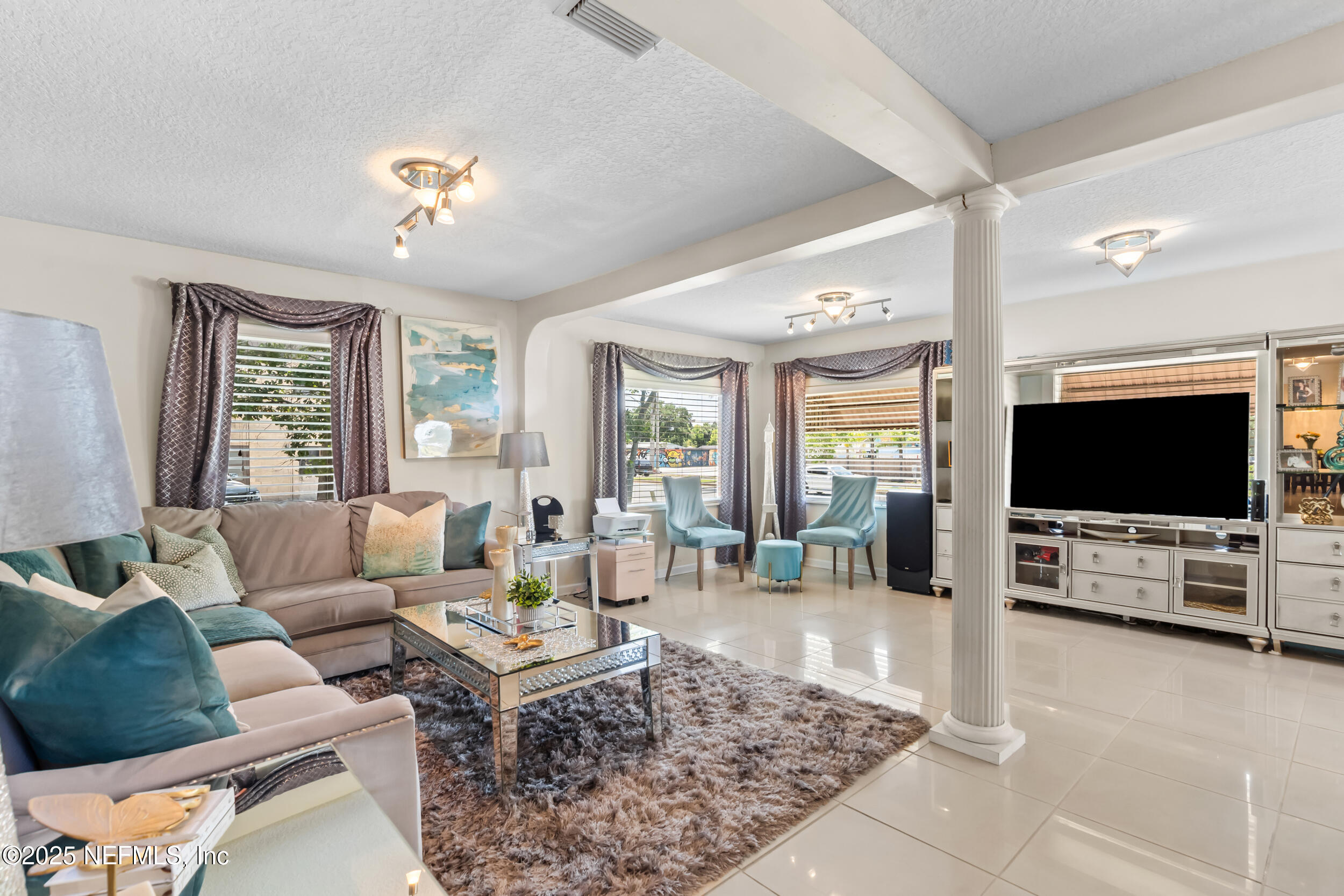 1887 Mayport Road Atlantic Beach, FL 32233 - Photo 12 of 50 a living room with furniture and a flat screen tv