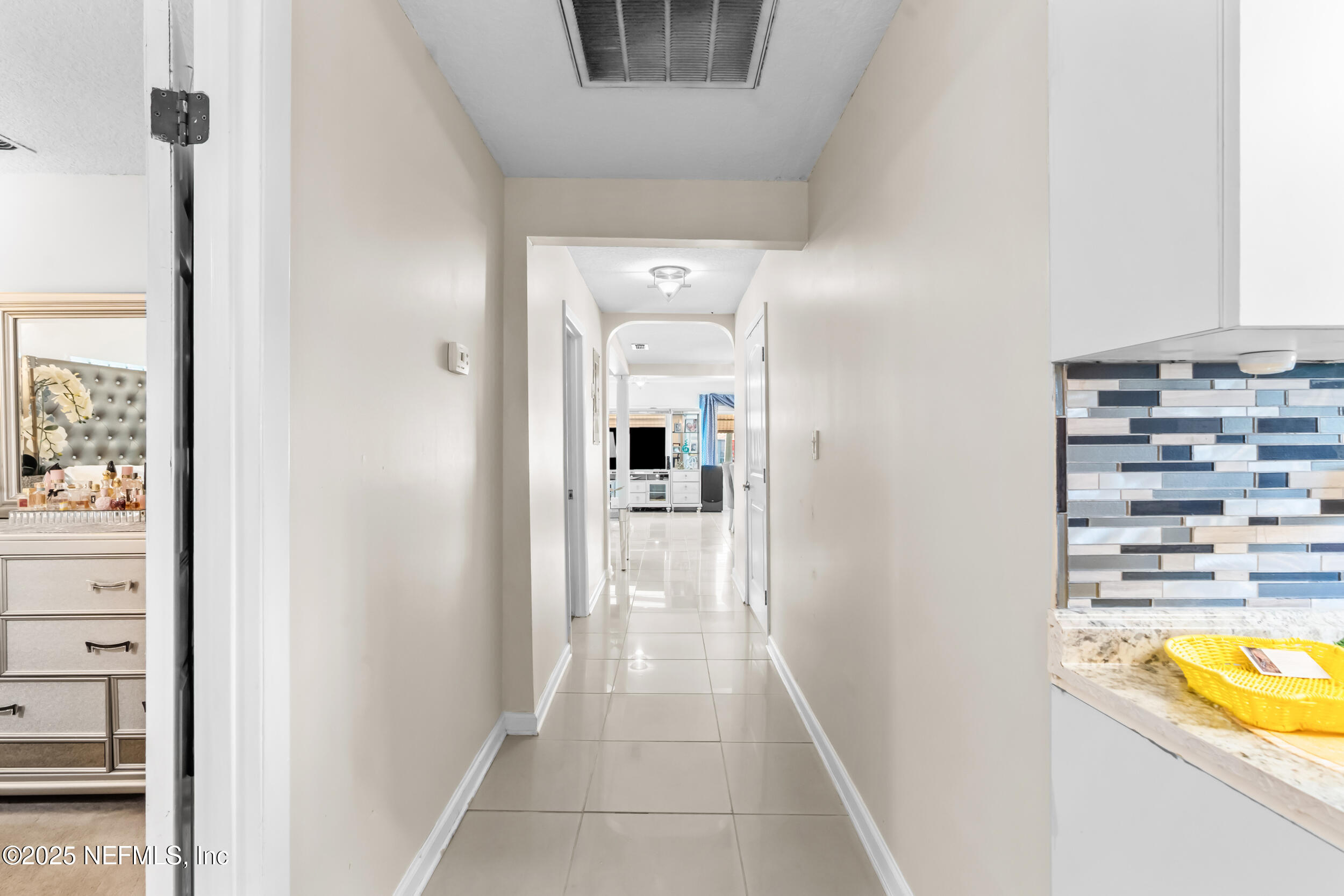 1887 Mayport Road Atlantic Beach, FL 32233 - Photo 20 of 50 a view of a hallway with wooden floor and a bathroom