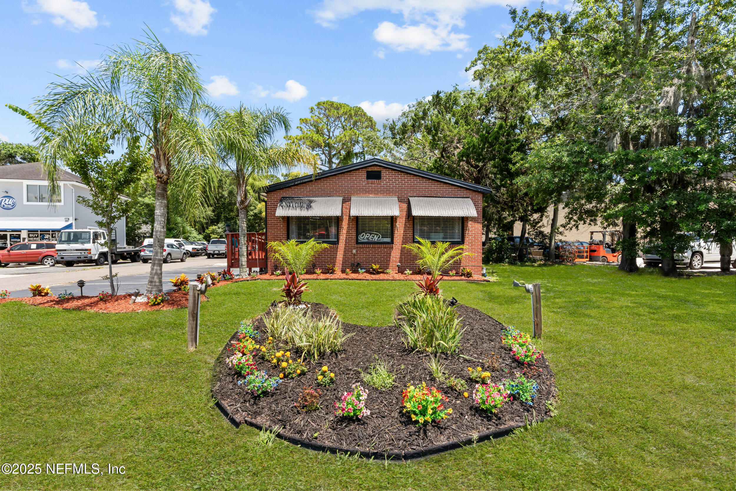 1887 Mayport Road Atlantic Beach, FL 32233 - Photo 2 of 50 a view of a house with a yard porch and sitting area