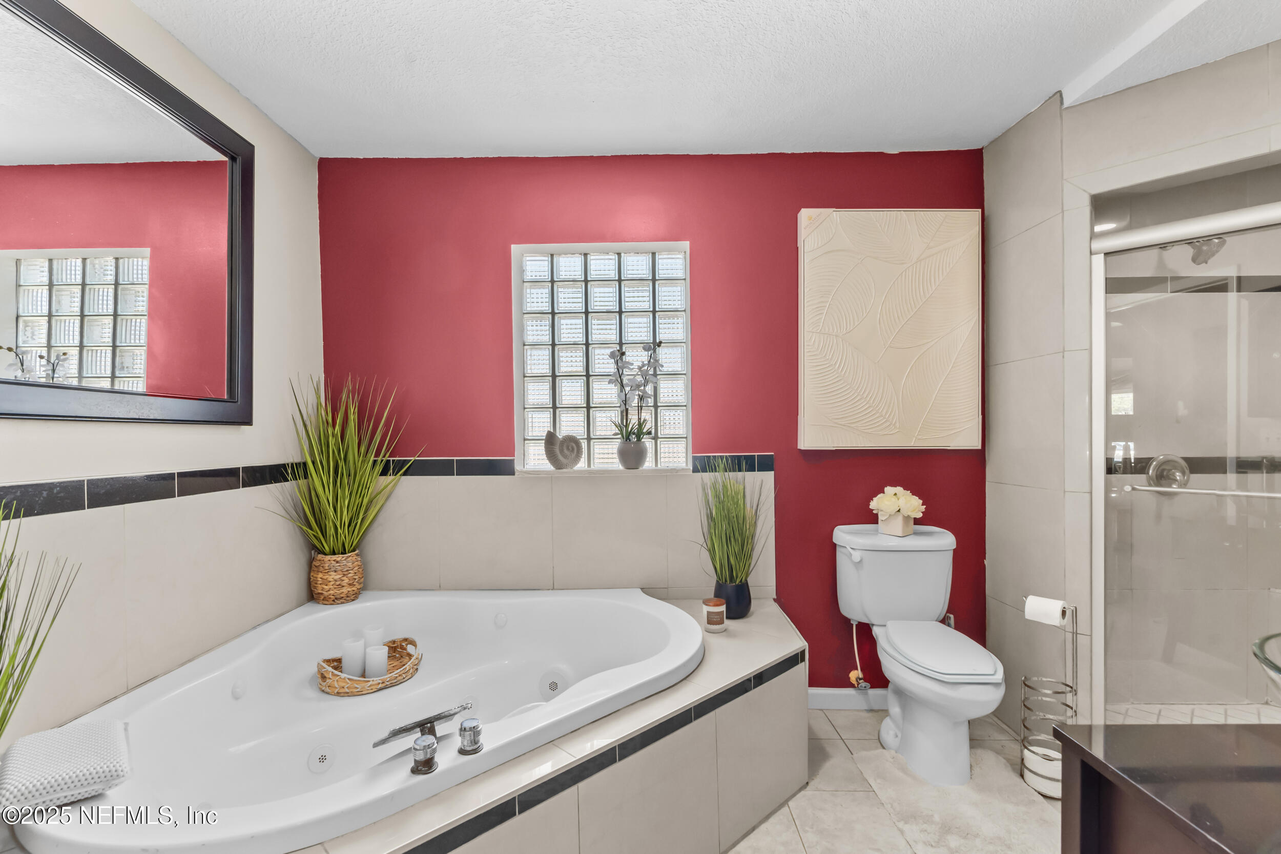 1887 Mayport Road Atlantic Beach, FL 32233 - Photo 23 of 50 a bathroom with a bath tub a mirror and a toilet