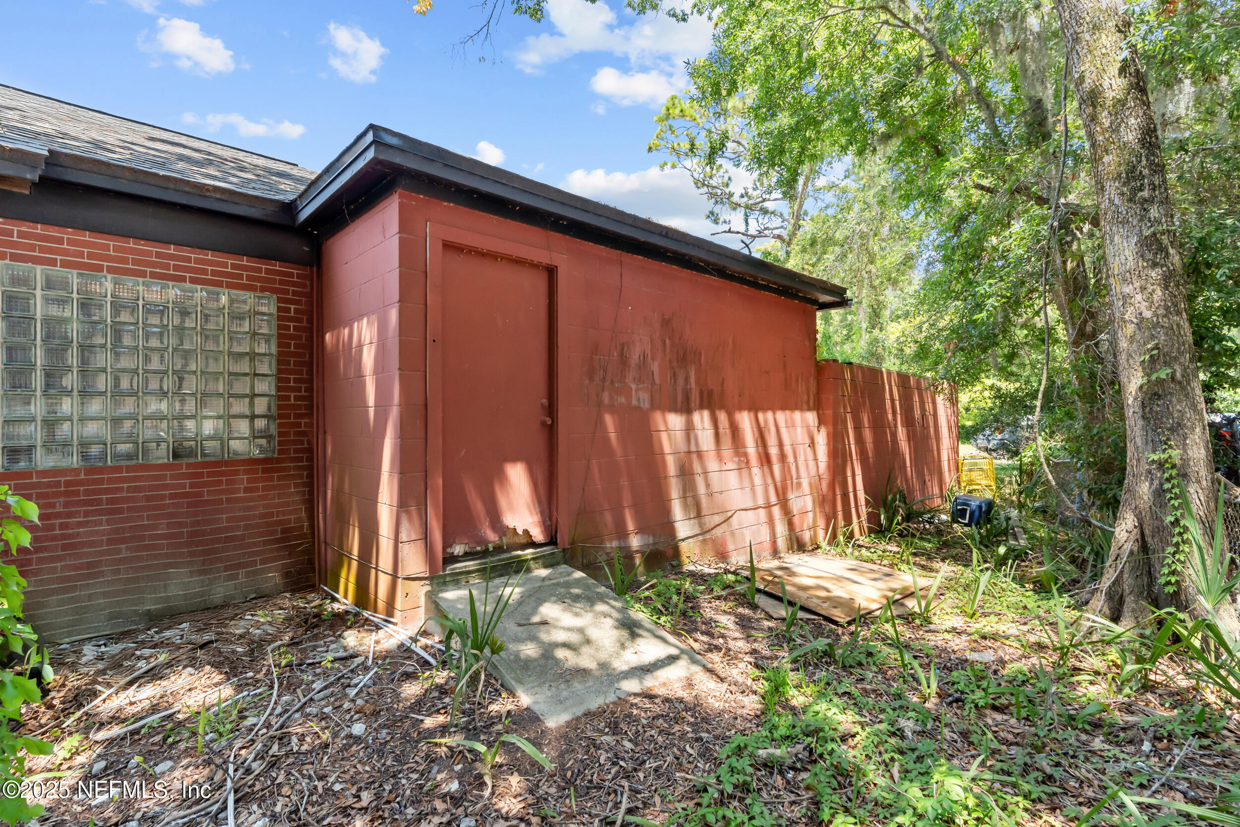 1887 Mayport Road Atlantic Beach, FL 32233 - Photo 33 of 50 a view of a house with backyard and trees