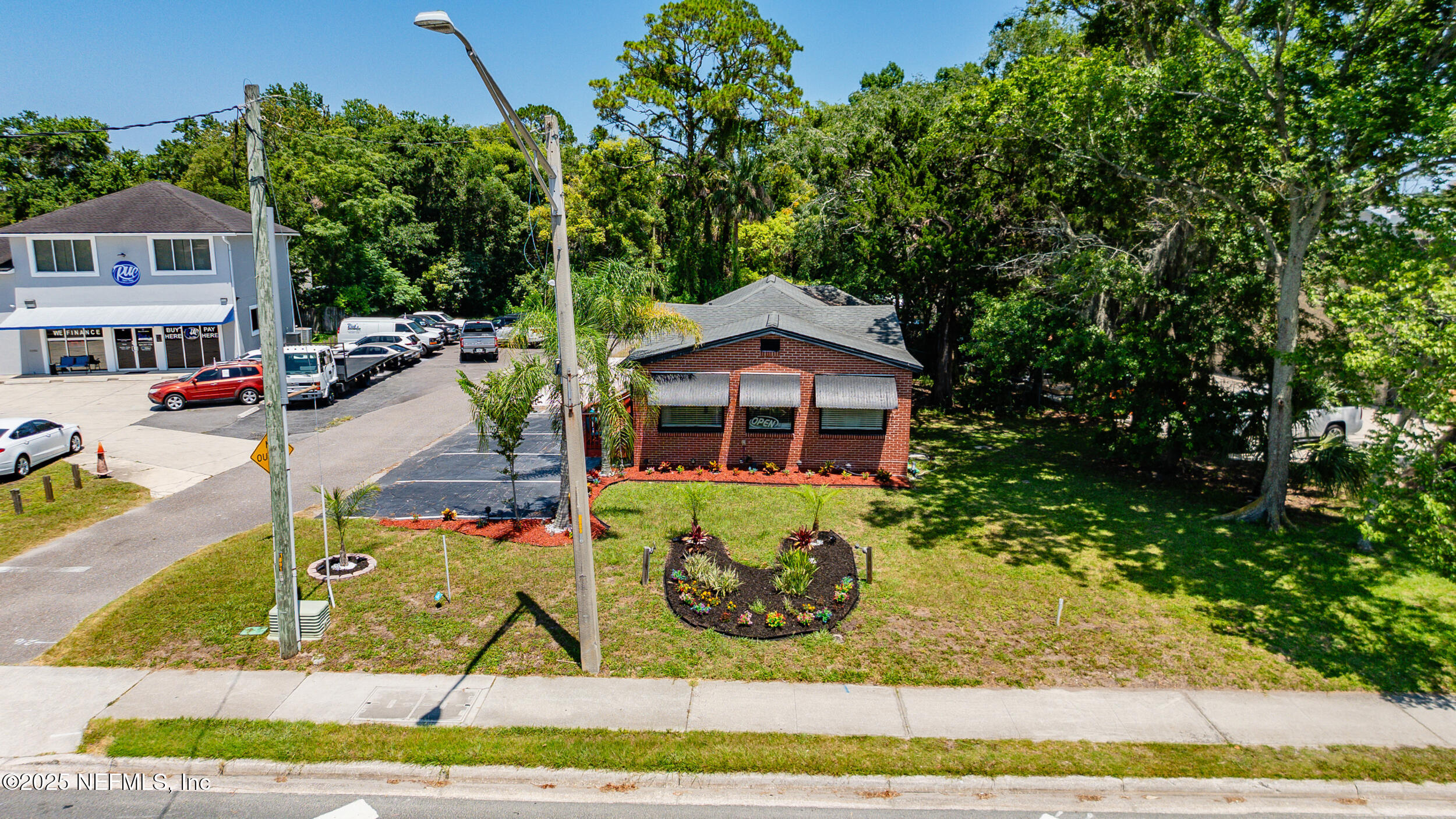 1887 Mayport Road Atlantic Beach, FL 32233 - Photo 46 of 50 a front view of a house with a yard