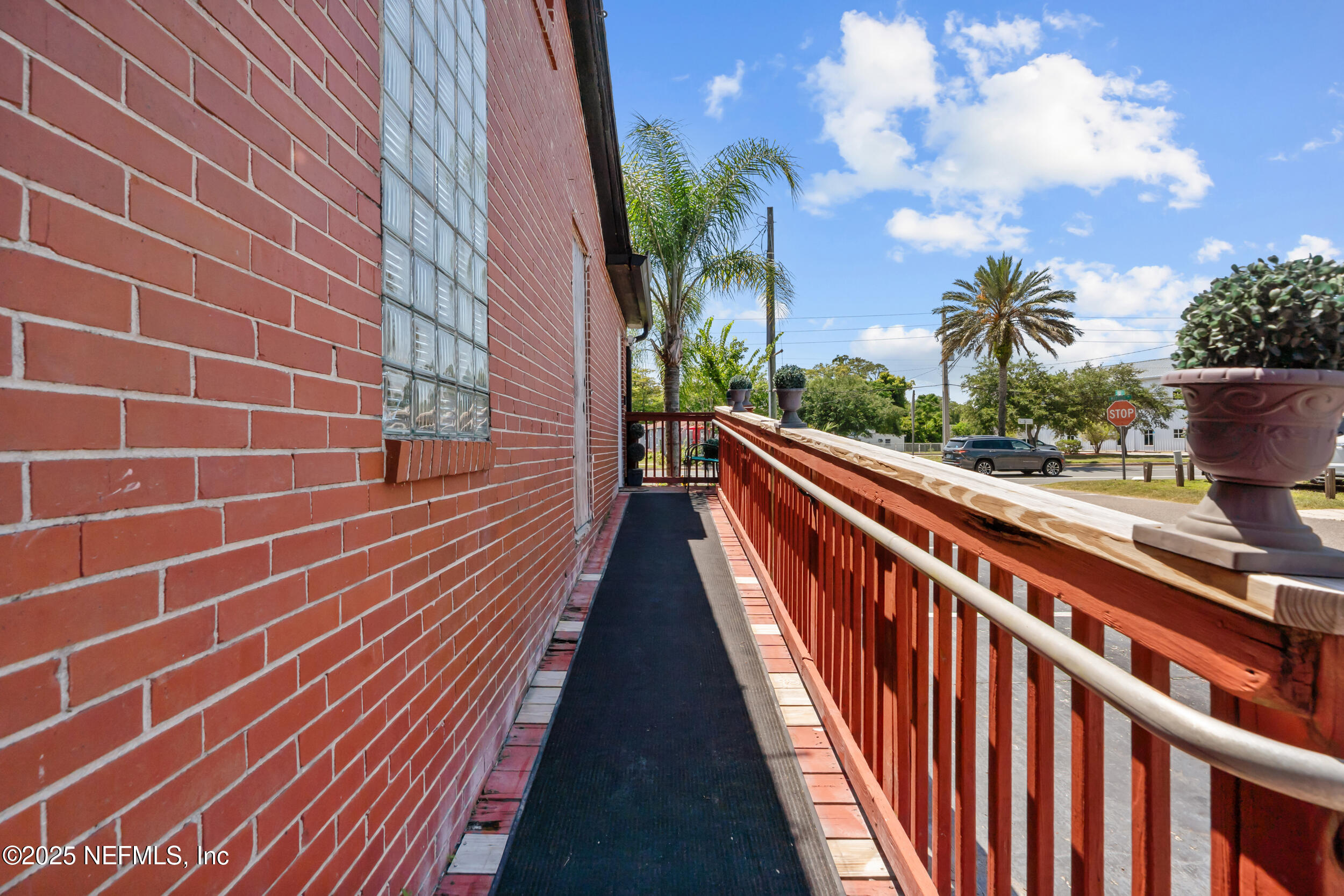 1887 Mayport Road Atlantic Beach, FL 32233 - Photo 6 of 50 a view of balcony with wooden floor and outdoor space