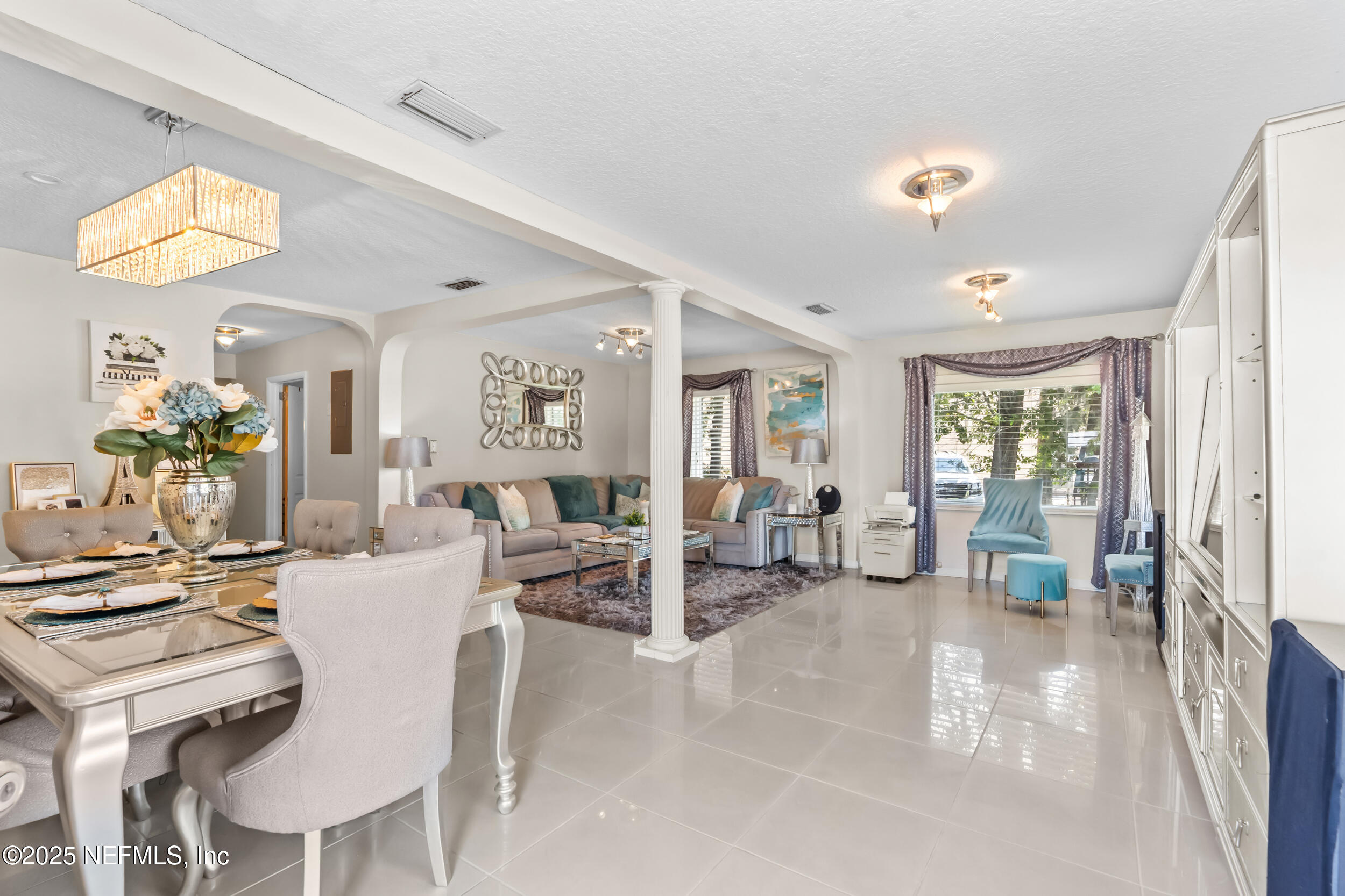 1887 Mayport Road Atlantic Beach, FL 32233 - Photo 7 of 50 a living room with furniture and large windows