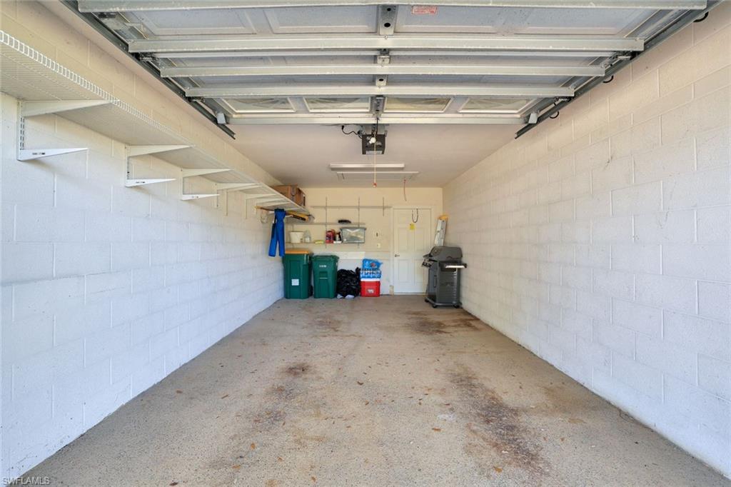 5967 Sand Wedge Lane, Unit 104 Naples, FL 34110 - Photo 17 of 41 a view of a garage
