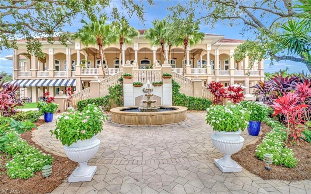 5967 Sand Wedge Lane, Unit 104 Naples, FL 34110 - Photo 29 of 41 a view of a fountain with potted plants