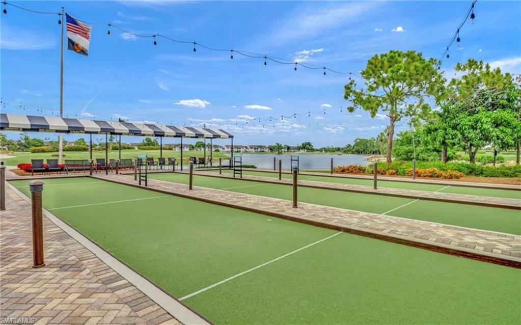 5967 Sand Wedge Lane, Unit 104 Naples, FL 34110 - Photo 33 of 41 a view of a tennis court