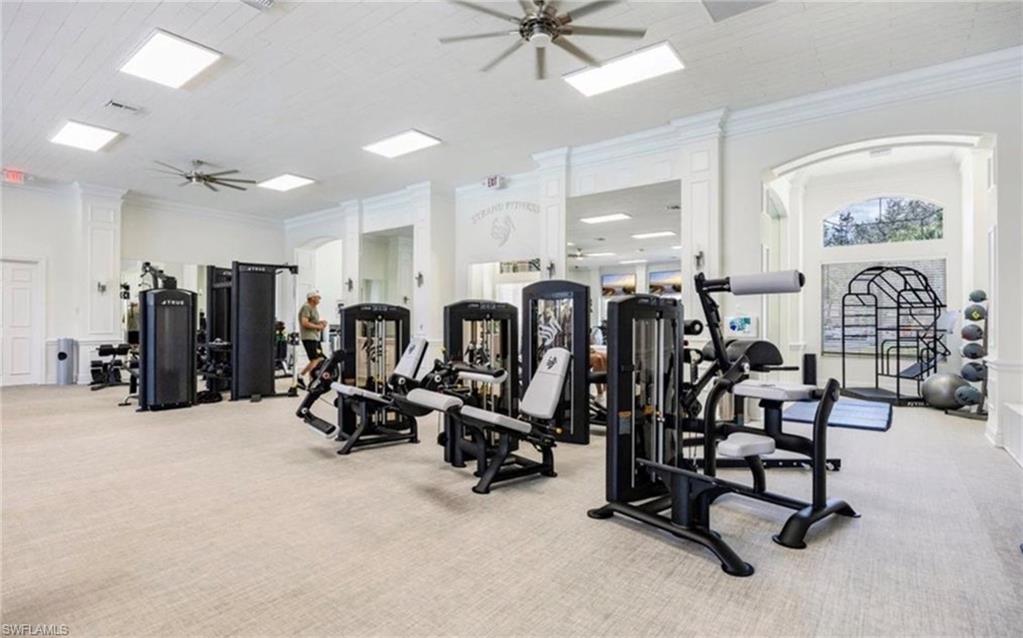 5967 Sand Wedge Lane, Unit 104 Naples, FL 34110 - Photo 37 of 41 a view of a room with gym equipment