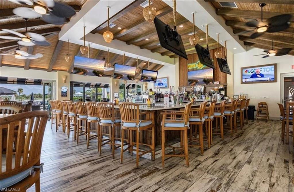 5967 Sand Wedge Lane, Unit 104 Naples, FL 34110 - Photo 41 of 41 a view of a bar restaurant