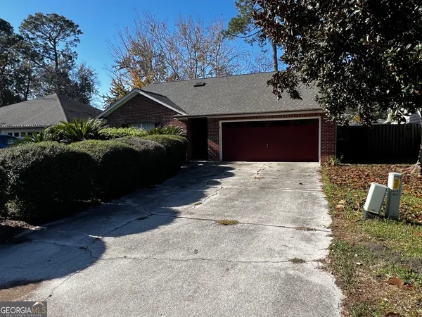 a front view of a house with yard