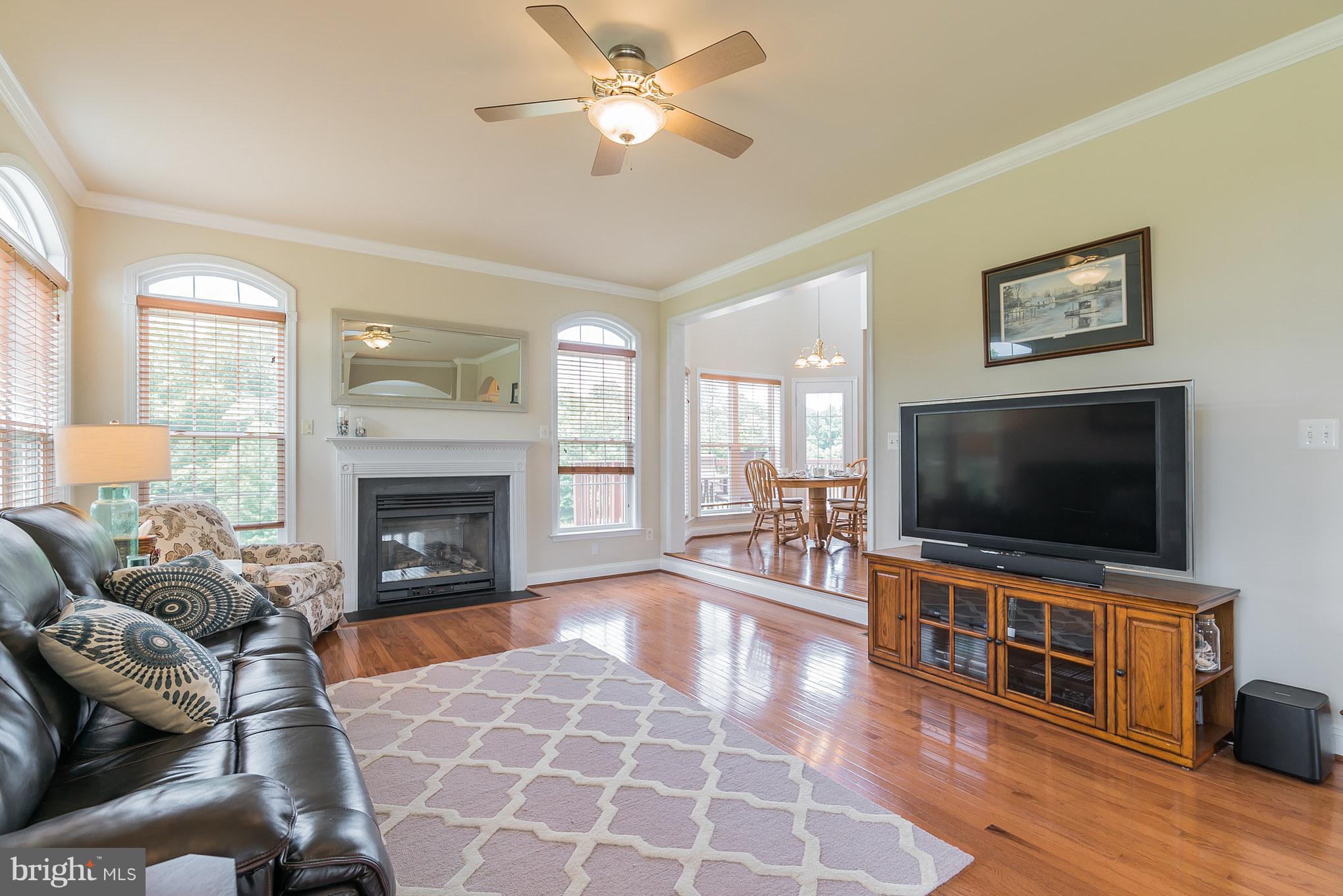 7420 Flint Hill Road Owings, MD 20736 - Photo 14 of 30 a living room with furniture and a flat screen tv