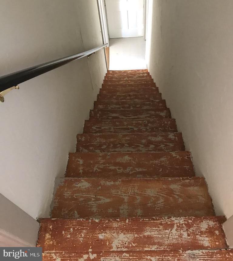 21927 Foxcroft Road Middleburg, VA 20117 - Photo 10 of 10 Painted stairway, bathroom is down stairs on right