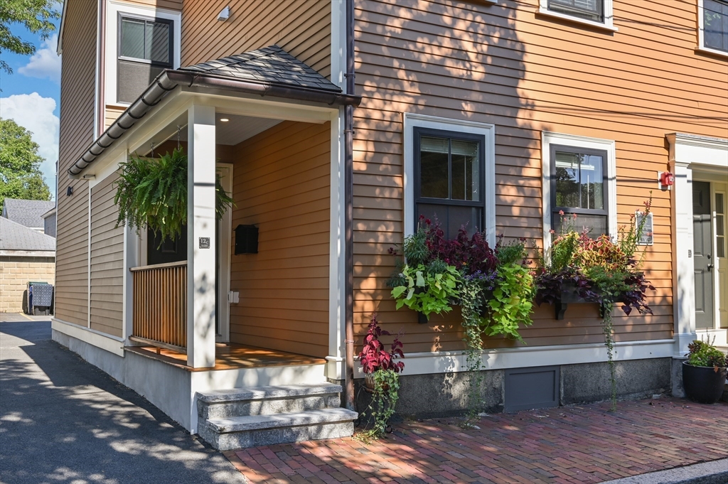 12 Mall Street, Unit C Salem, MA 01970 - Photo 2 of 31 a front view of a house with plants
