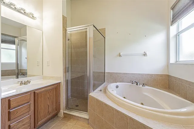 a bathroom with a bathtub and a sink