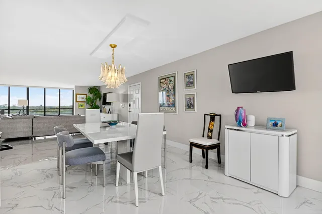 a view of a livingroom with furniture and a flat screen tv