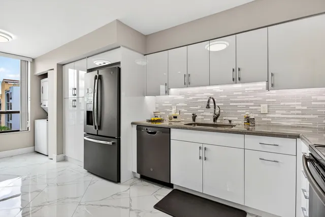 a kitchen with granite countertop cabinets and stainless steel appliances