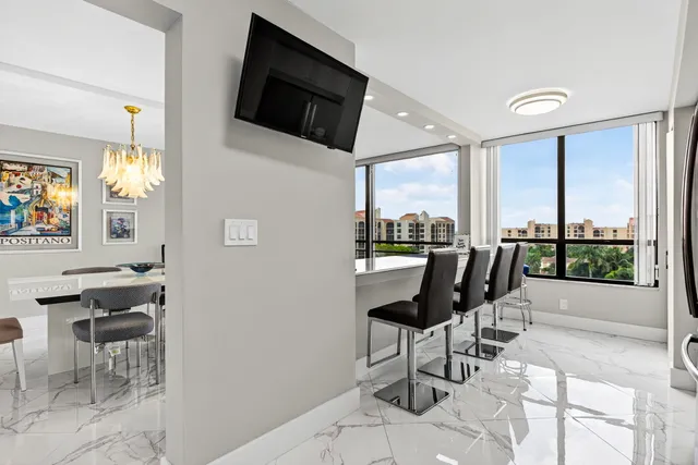 a view of a livingroom with furniture and flat screen tv
