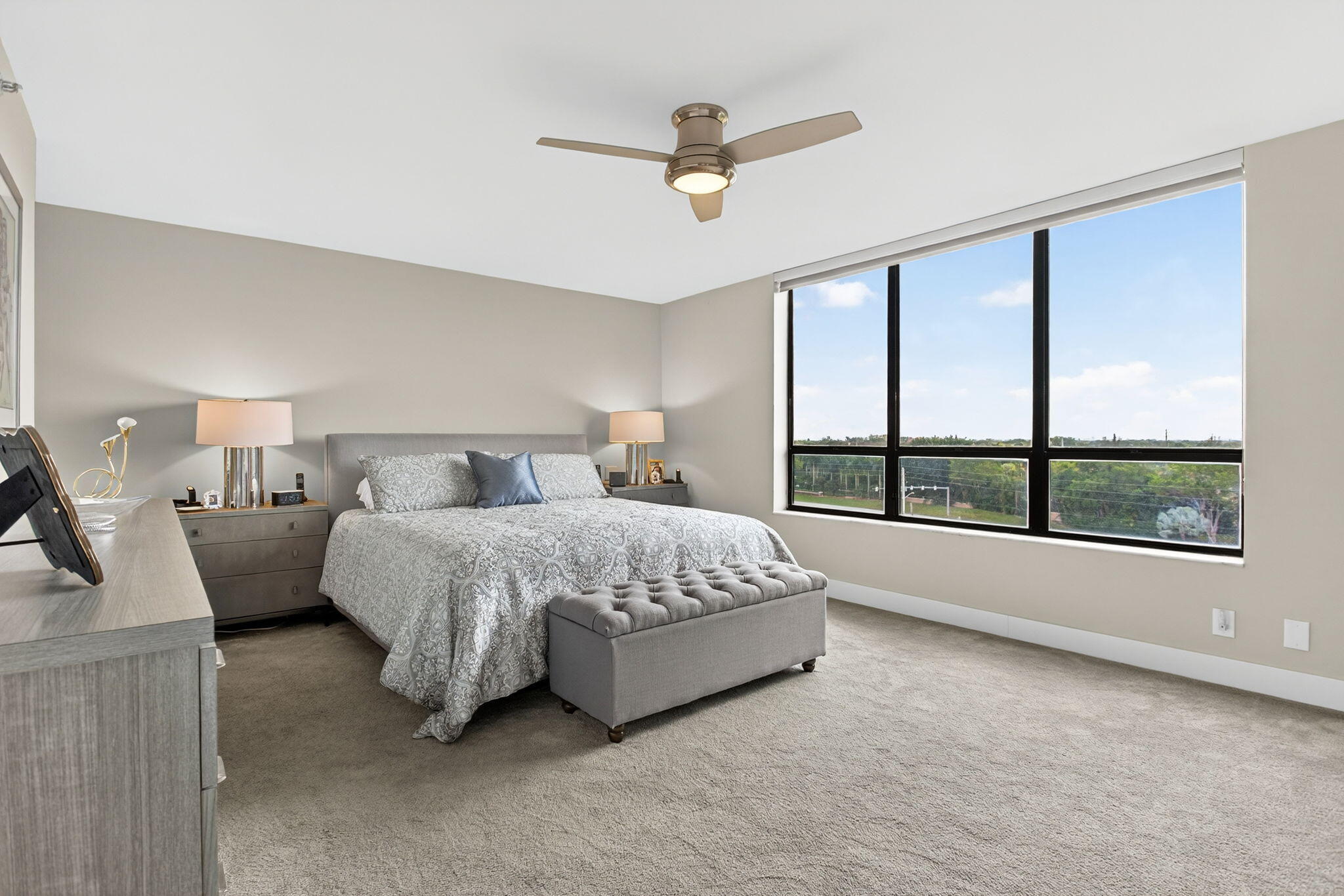 7186 Promenade Drive, Unit 701 Boca Raton, FL 33433 - Photo 21 of 39 a spacious bedroom with a bed and a large window