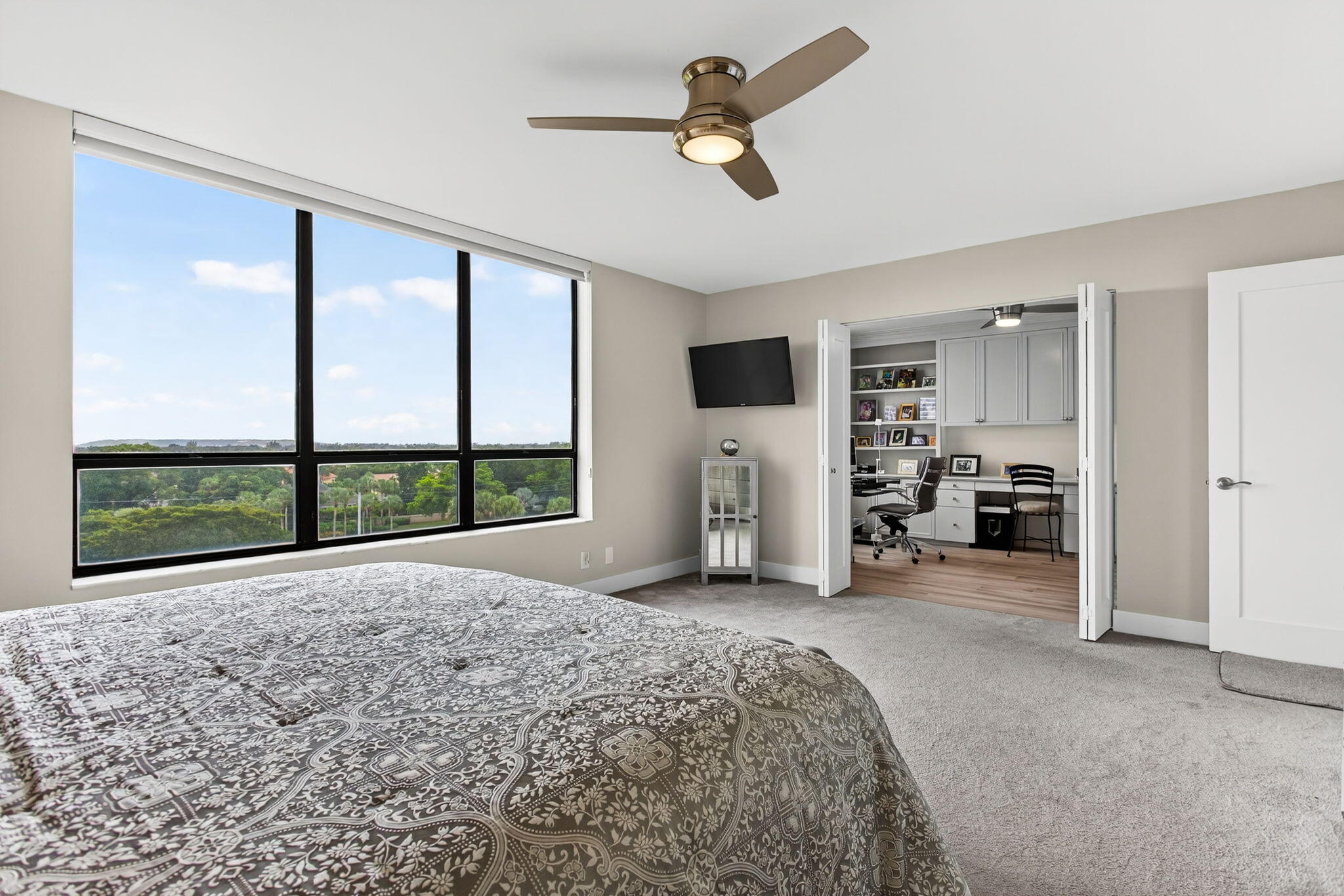 7186 Promenade Drive, Unit 701 Boca Raton, FL 33433 - Photo 22 of 39 a view of a livingroom with a flat screen tv