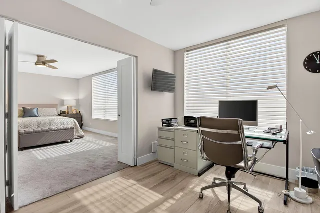 a bedroom with furniture and a fireplace