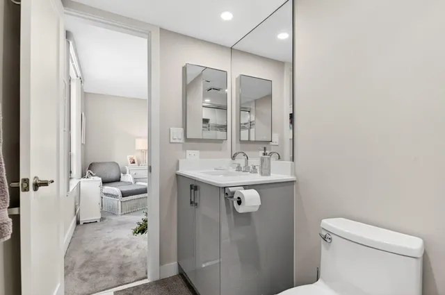 a en suite bathroom with a sink a toilet and shower