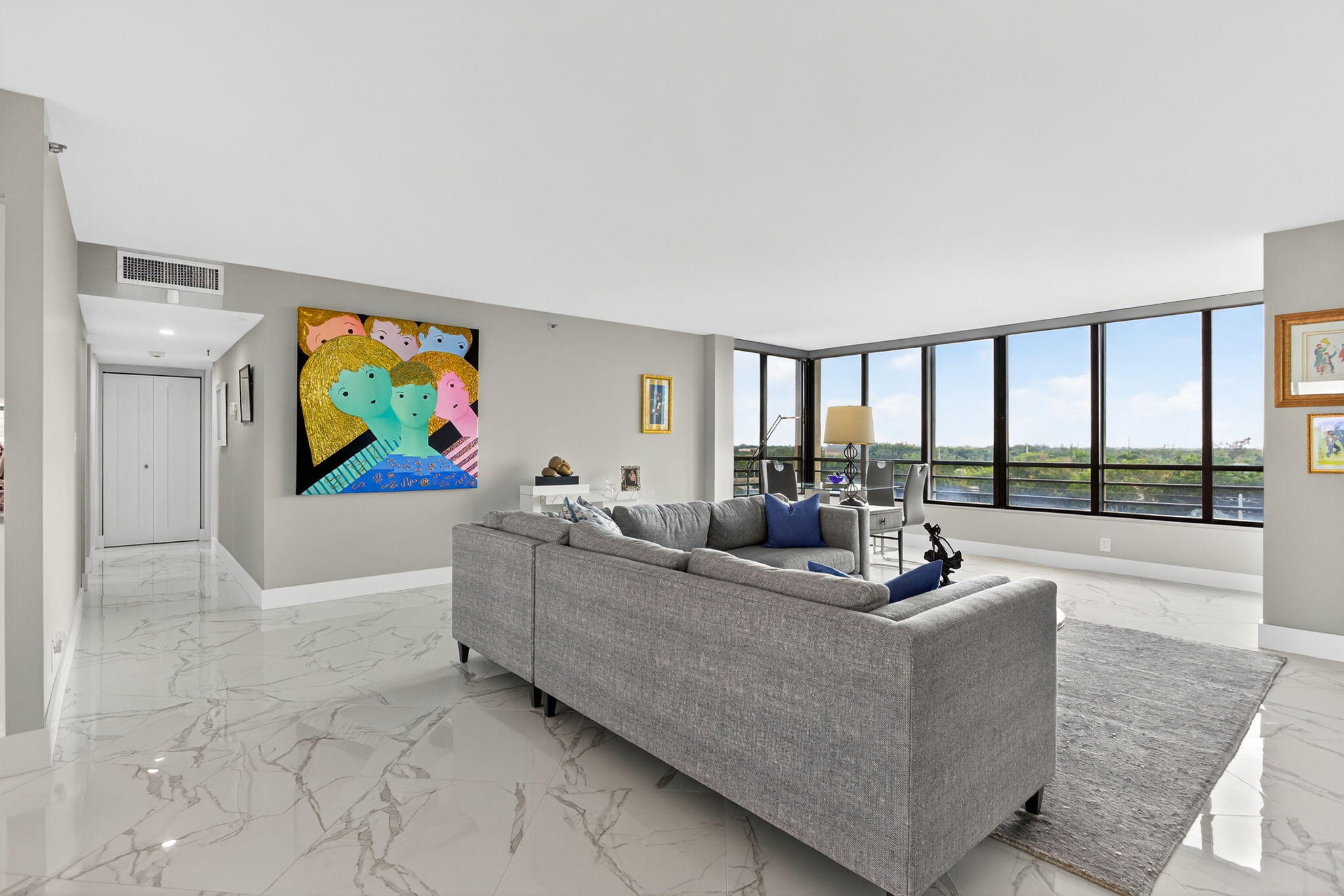 7186 Promenade Drive, Unit 701 Boca Raton, FL 33433 - Photo 6 of 39 a living room with fireplace furniture and a flat screen tv