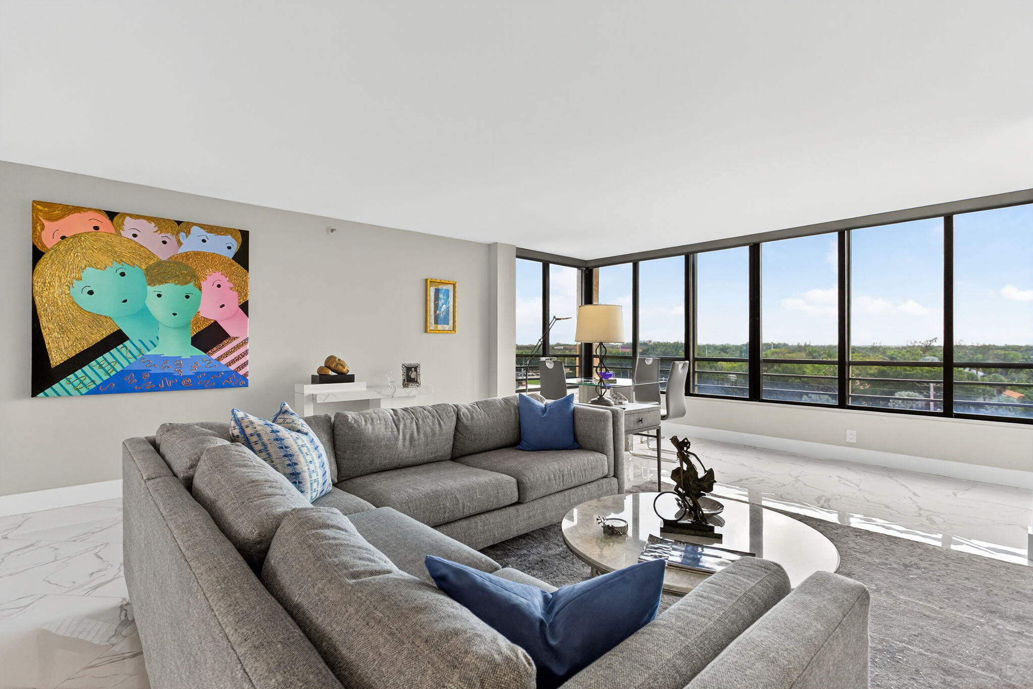 7186 Promenade Drive, Unit 701 Boca Raton, FL 33433 - Photo 8 of 39 a living room with furniture and a large window