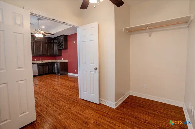 a view of room with hardwood floor